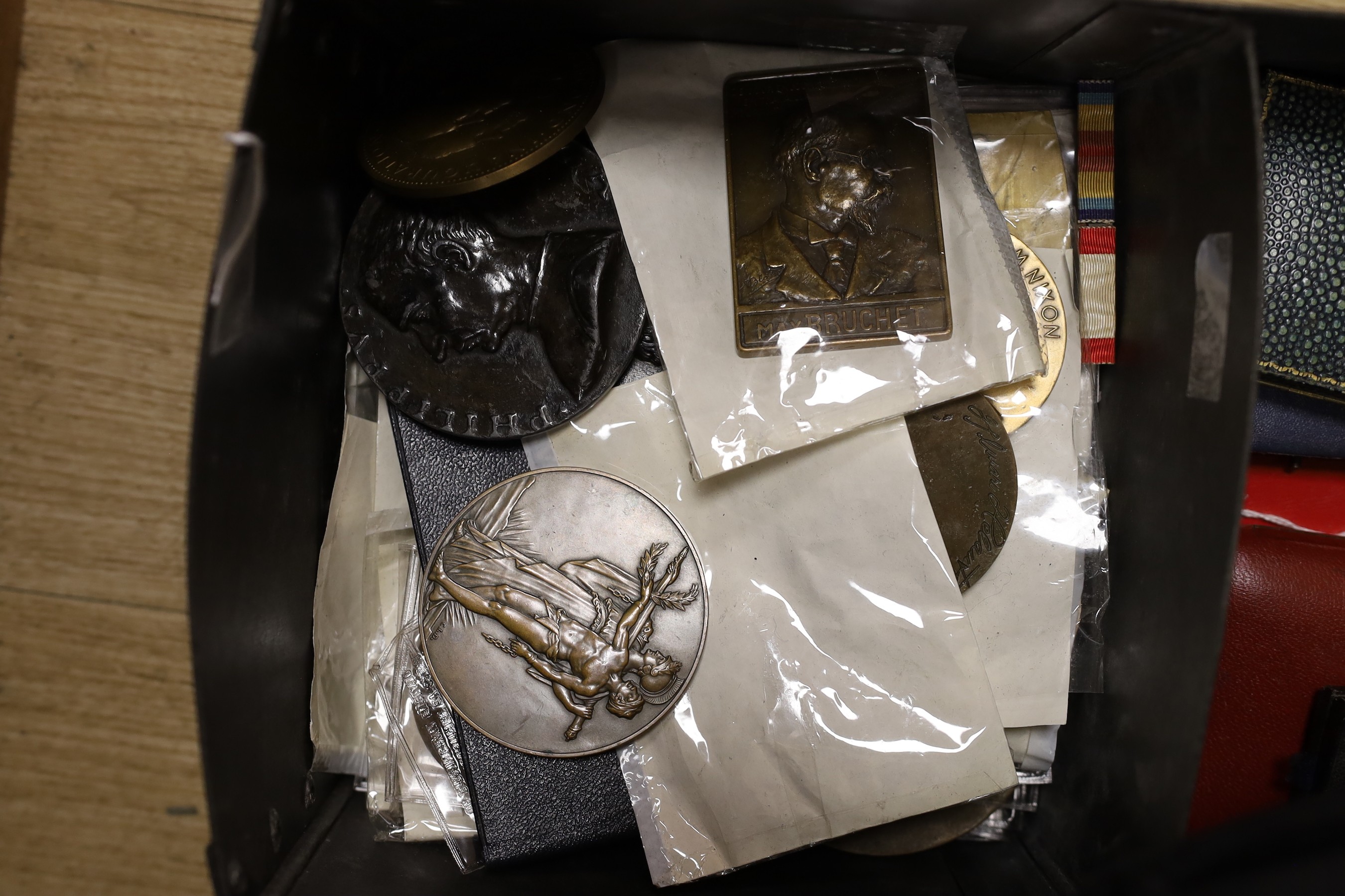 A large and varied collection of mostly continental cast metal commemorative medallions, to include political, musical and other cultural subjects together with two Japanese cased medals (quantity)